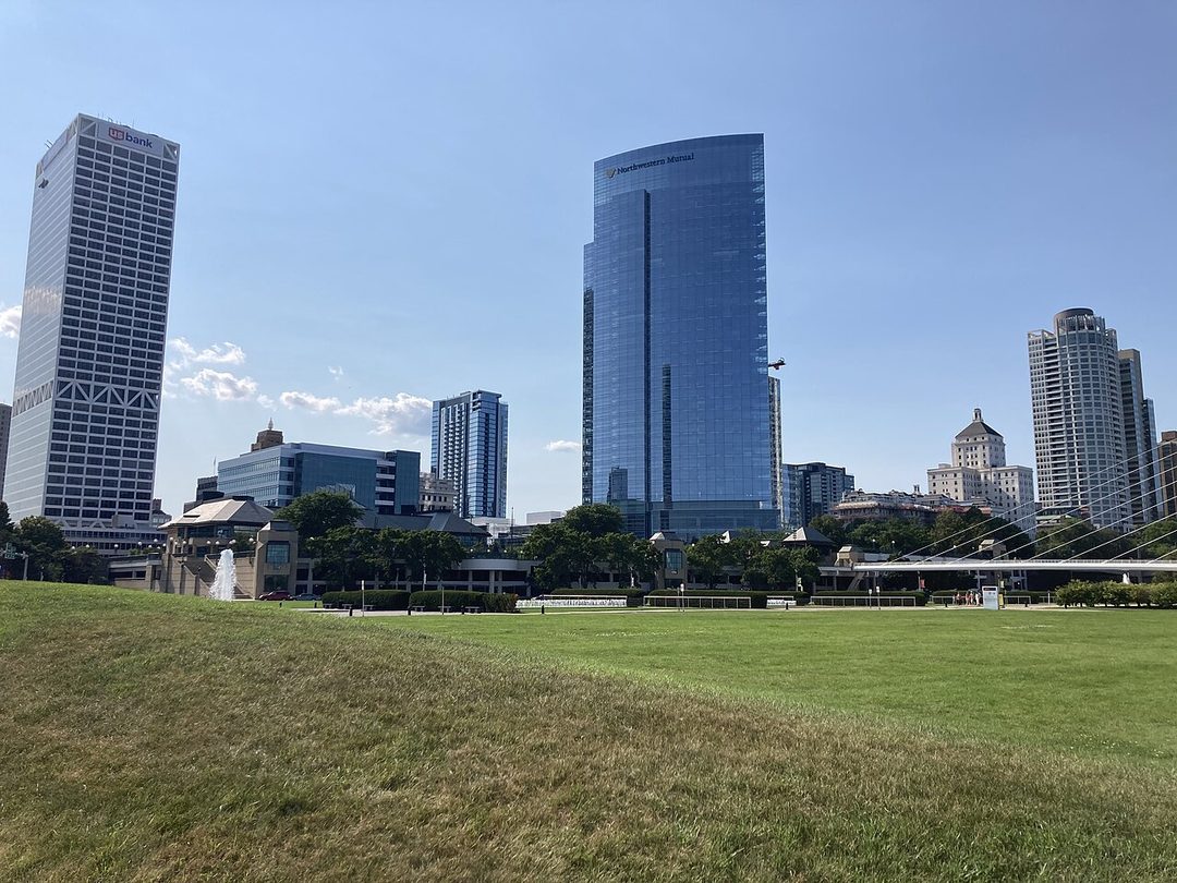Milwaukee skyline seen from a grassy park area on a clear day